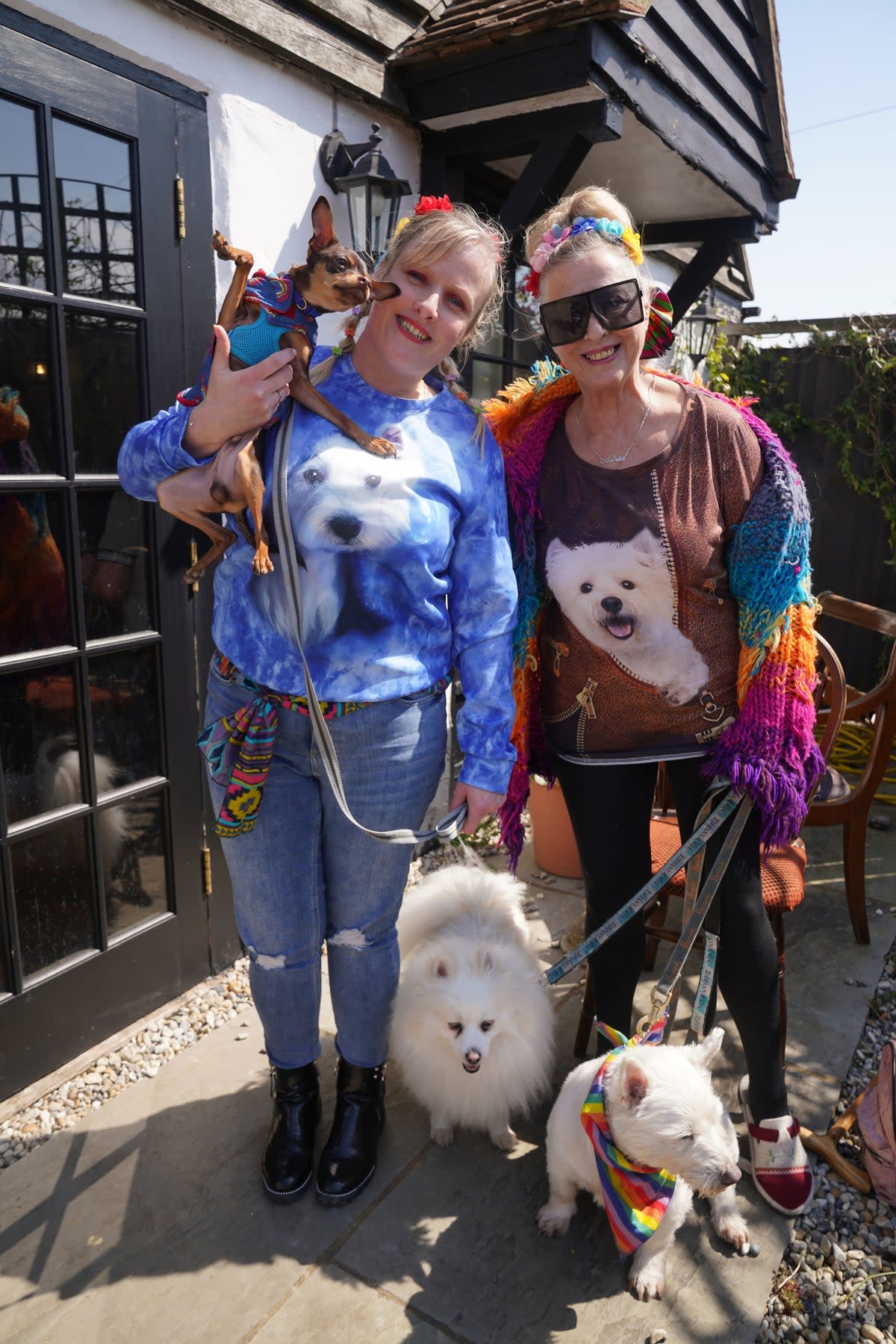 Fleur Boyd (left) with her mother Astrid Allen from Margate with their dog Zeus outside the Walnut Tree Pub (PA)