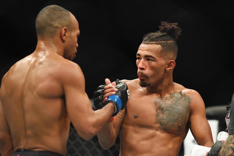 Mar 23, 2019; Nashville, TN, USA; Jordan Espinosa (blue gloves) greets Eric Shelton (red gloves) after their fight during UFC Fight Night at Bridgestone Arena. Mandatory Credit: Christopher Hanewinckel-USA TODAY Sports