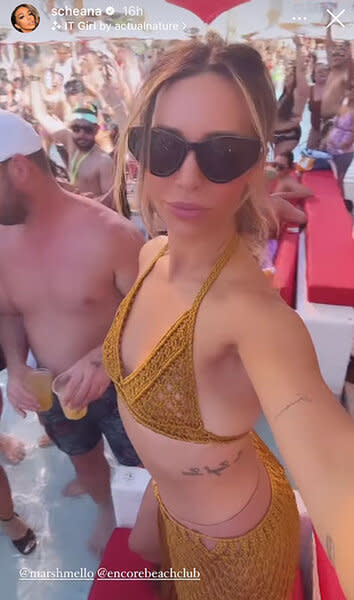 Scheana Shay wearing sunglasses and a mustard, crochet, 2-piece set at Encore beach club in Las Vegas.