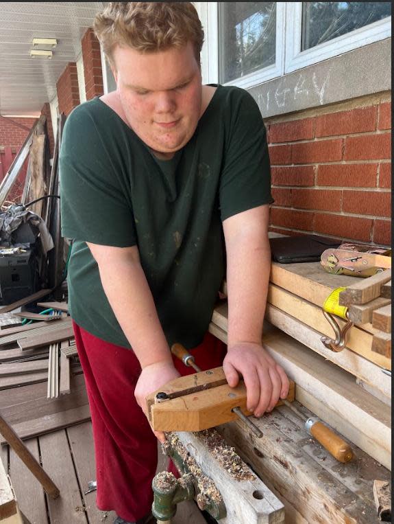 Kieran gained the skills to help his dad, Jonathan Crone, do woodworking through the programming at Ausome. 