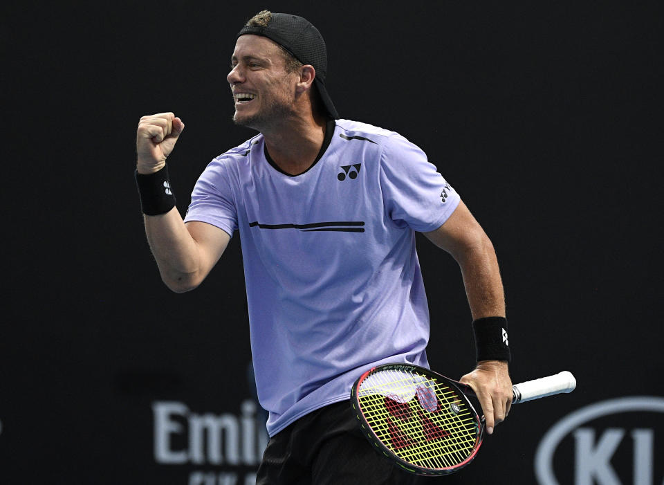 Australia's Lleyton Hewitt celebrates with compatriot John-Patrick Smith during their first round doubles match against New Zealand's Marcus Daniels and Wesly Koolhof of the Netherlands at the Australian Open tennis championships in Melbourne, Australia, Thursday, Jan. 17, 2019. (AP Photo/Andy Brownbill)