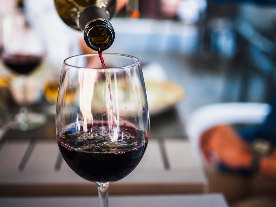 wine being poured into a glass