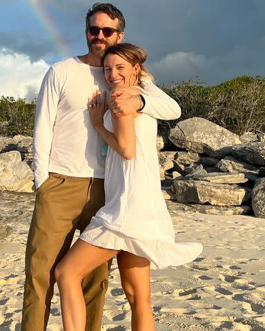 <p>Ryan Reynolds/Instagram</p> Blake Lively (right) and Ryan Reynolds (left) pose on the beach together.