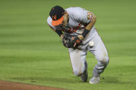 Baltimore Orioles second baseman Pat Valaika bobbles a ground ball by Toronto Blue Jays' Joe Panik, but still records the out, during the fifth inning of the baseball game in Buffalo, N.Y., Thursday, June 24, 2021. (AP Photo/Joshua Bessex)