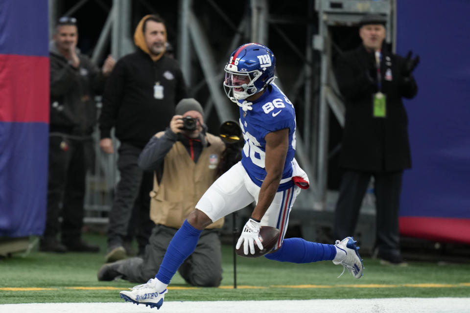 New York Giants wide receiver Darius Slayton (86) celebrates after running in a touchdown pass during the second half an NFL football game against the Los Angeles Rams, Sunday, Dec. 31, 2023, in East Rutherford, N.J. (AP Photo/Seth Wenig)