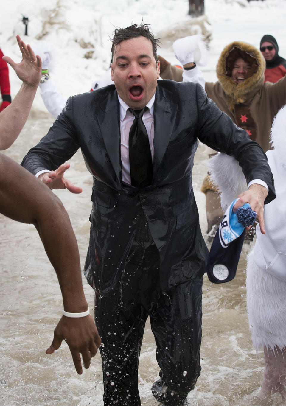 "The Tonight Show" host Jimmy Fallon exits the water during the Chicago Polar Plunge, Sunday, March 2, 2014, in Chicago. Fallon joined Chicago Mayor Rahm Emanuel in the event. (AP Photo/Andrew A. Nelles)