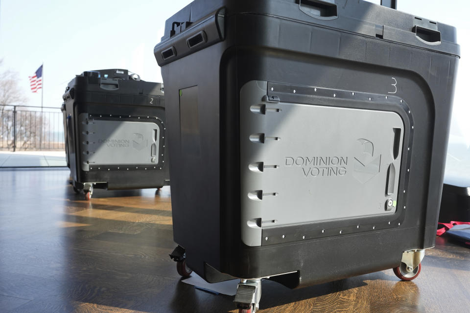 Dominion Voting tabulator machines are shown in use for the Michigan primary election in Grosse Pointe Farms, Mich., Tuesday, Feb. 27, 2024. Michigan is the last major primary state before Super Tuesday and a critical swing state in November's general election. (AP Photo/Paul Sancya)