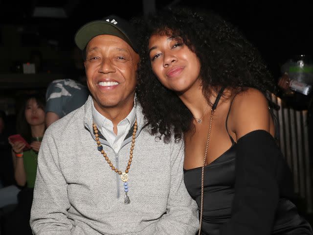 <p>Johnny Nunez/WireImage</p> Russell Simmons and Aoki Lee Simmons attend Champ Medici And Fam Lounge at Marquee on June 19, 2022 in New York City.