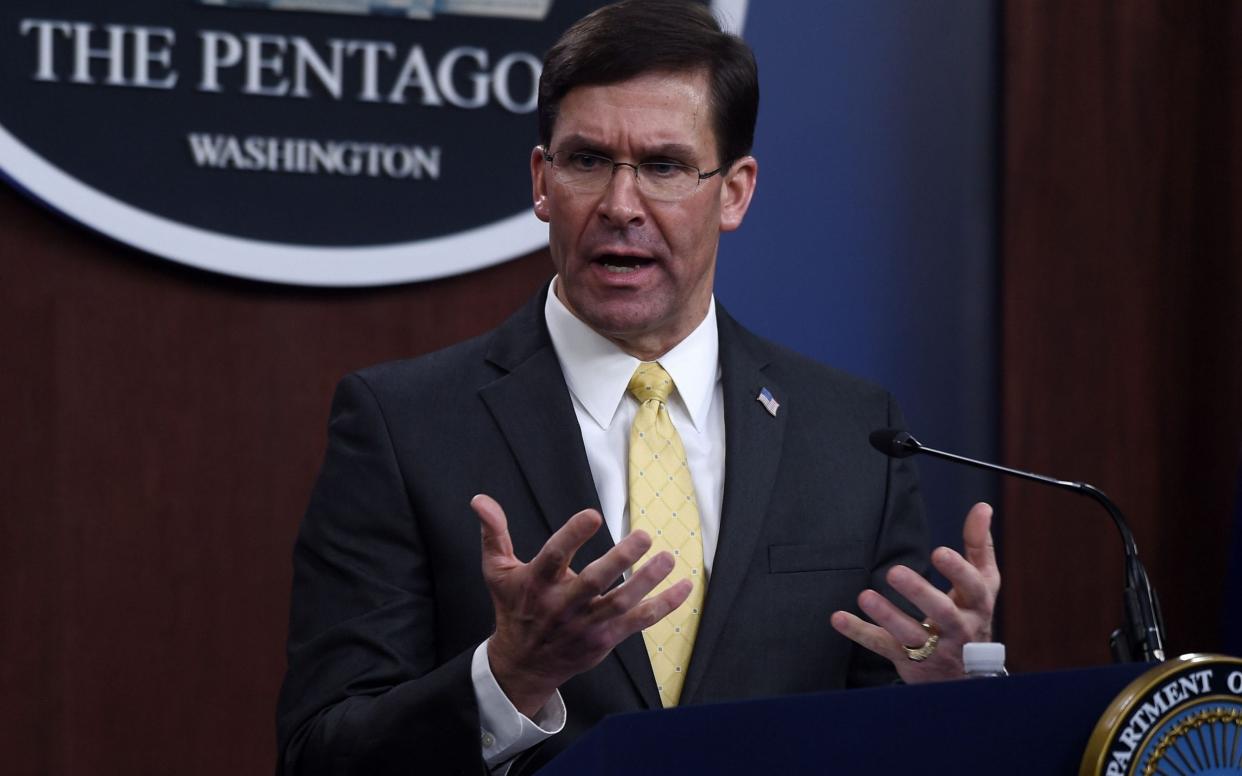 Mark Esper reminded his counterpart about China abiding by its "international commitments" - AFP