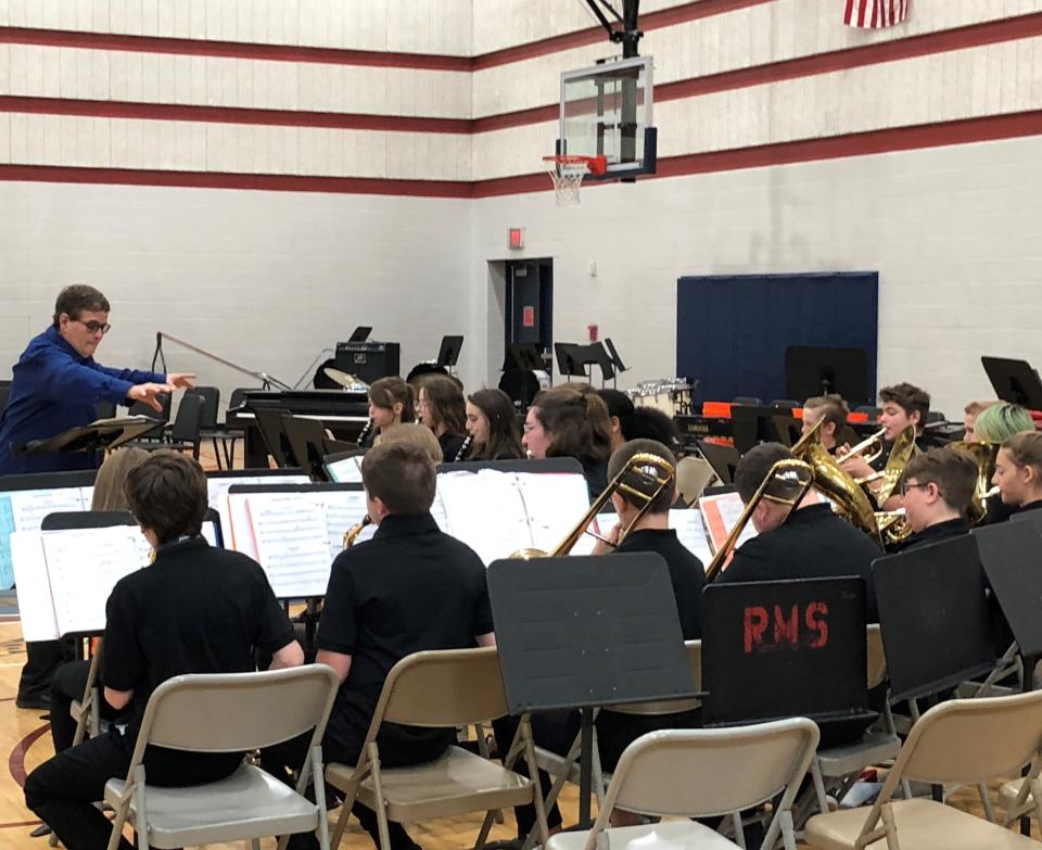 Diana Wightman directs the Liberty Middle School sixth grade band last week, during her final concert for Newark City Schools.