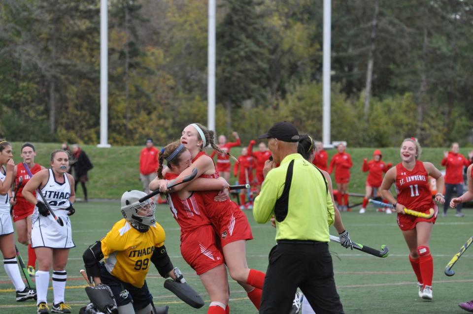 Lucy Stillman and Bailey Sherwin celebrate while playing for St. Lawrence University.