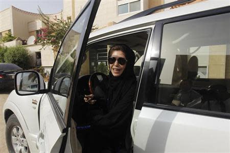 Female driver Azza Al Shmasani alights from her car after driving in defiance of the ban in Riyadh June 22, 2011. REUTERS/Fahad Shadeed