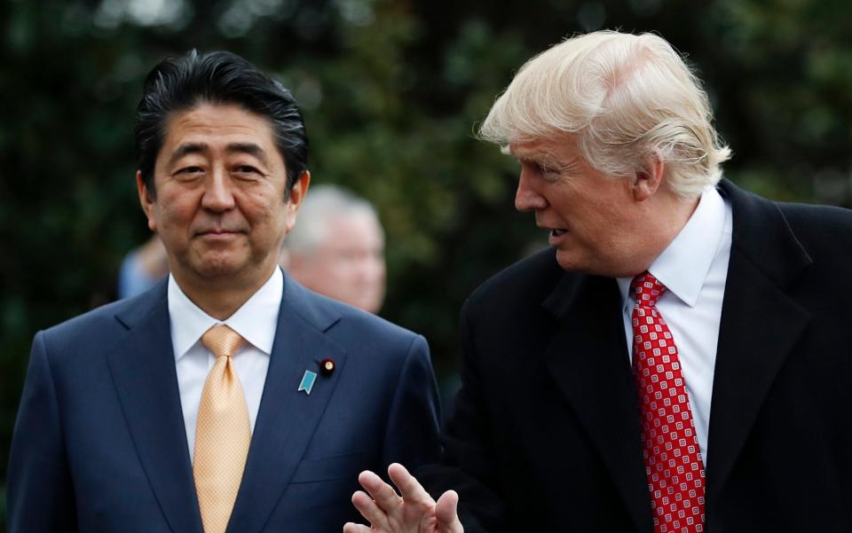 Shinzo Abe met Donald Trump last month in the US - Credit: AP