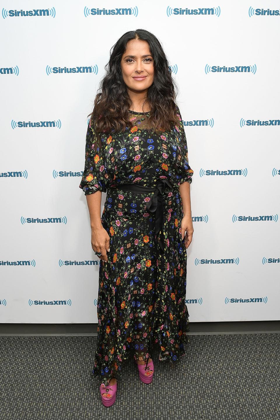 <p>Salma showed her flair for fashion in a dark floral maxi and sky-high pink platforms.<br><i>[Photo: Getty]</i> </p>