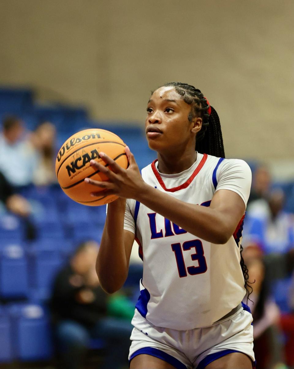 King's Academy girls basketball senior Jade Jones (13) shoots a free throw against Windermere Prep in a playoff game on Monday, Feb. 19, 2024 in West Palm Beach.