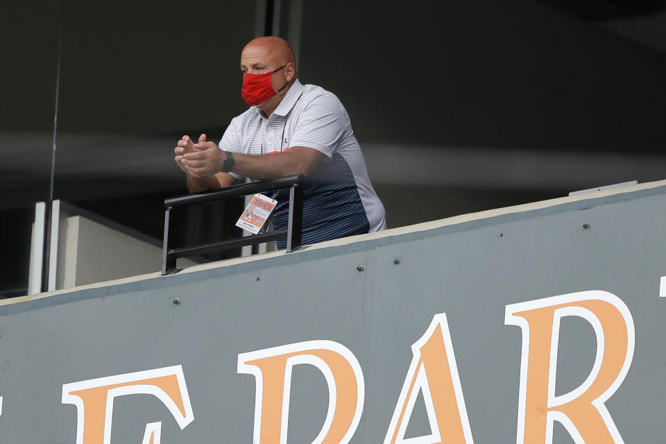 FILE - In this Aug. 14, 2020, file photo, Washington Nationals general manager Mike Rizzo looks on during the seventh inning in the continuation of a suspended baseball game between the Baltimore Orioles and the Nationals in Baltimore. On Wednesday, March 31, 2021, Rizzo said a player for the team has tested positive for COVID-19. Rizzo said that four teammates and a staff member have been quarantined on the eve of the start of the regular season after contact tracing. (AP Photo/Julio Cortez, File)