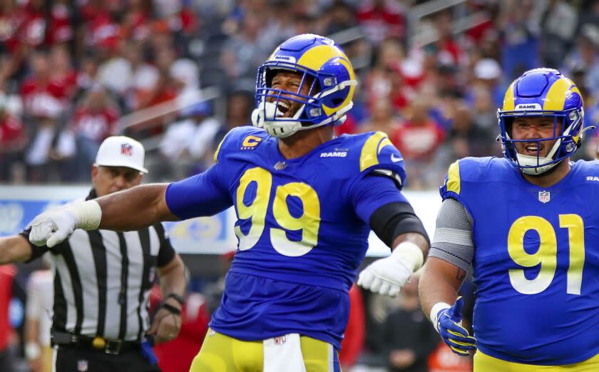 Inglewood, CA - October 30: Rams defensive tackle Aaron Donald, #99, celebrates sacking 49ers quarterback Jimmy Garoppolo.