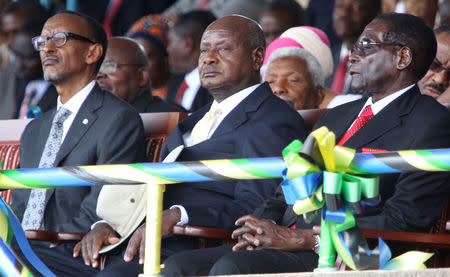 FILE PHOTO: Rwanda's President Paul Kagame (L), Uganda's President Yoweri Museveni (C) and Zimbabwe's President Robert Mugabe attend the inauguration ceremony of Tanzania's President-elect John Magufuli at the Uhuru Stadium in Dar es Salaam, November 5, 2015. REUTERS/Emmanuel Herman/File Photo