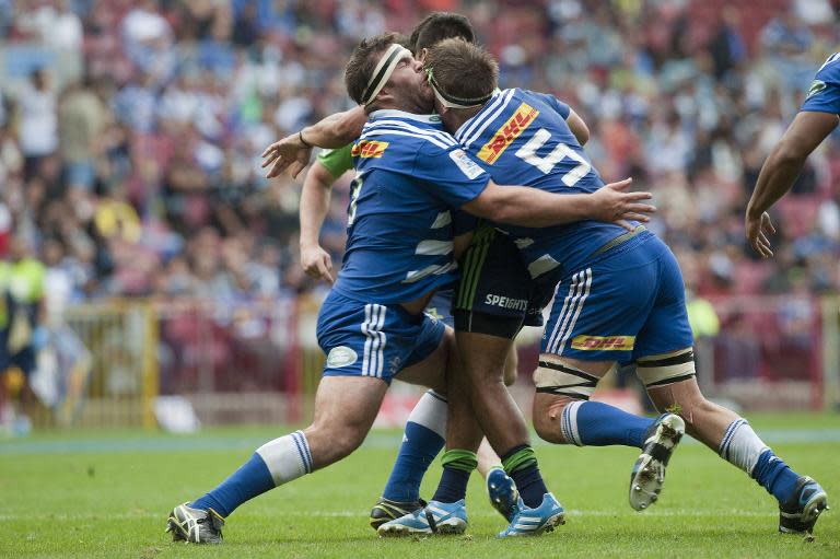 Stormers' Frans Malherbe (L) runs into teammate Michael Rhodes during a Super Rugby match at Newlands stadium in Cape Town, in May 2014