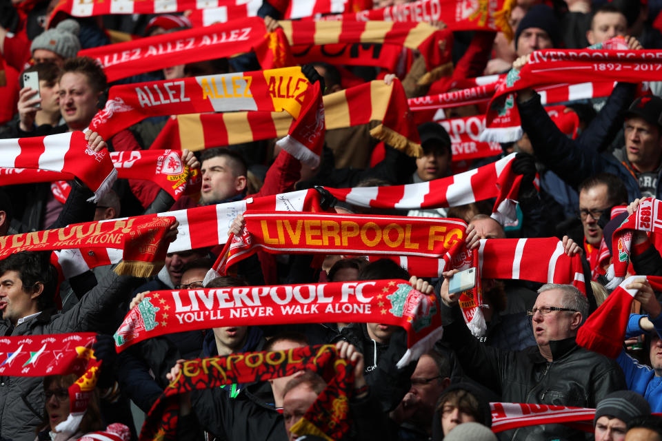 LIVERPOOL, ENGLAND - MARCH 07:  Fans of Liverpool show their support during the Premier League match between Liverpool FC and AFC Bournemouth  at Anfield on March 07, 2020 in Liverpool, United Kingdom. (Photo by Alex Livesey - Danehouse/Getty Images )