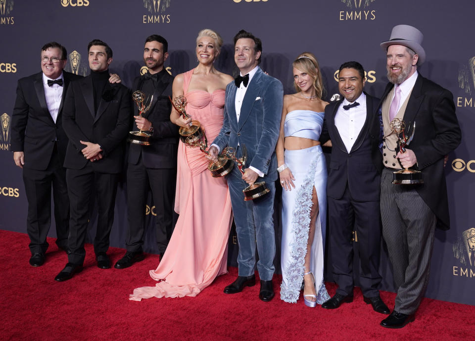 Brett Goldstein, Hannah Waddingham, Jason Sudeikis, Juno Temple and the cast and crew from "Ted Lasso" pose with their awards for outstanding supporting actor in a comedy series, outstanding supporting actress in a comedy series, outstanding lead actor in a comedy series and outstanding comedy series at the 73rd Primetime Emmy Awards on Sunday, Sept. 19, 2021, at L.A. Live in Los Angeles. (AP Photo/Chris Pizzello)