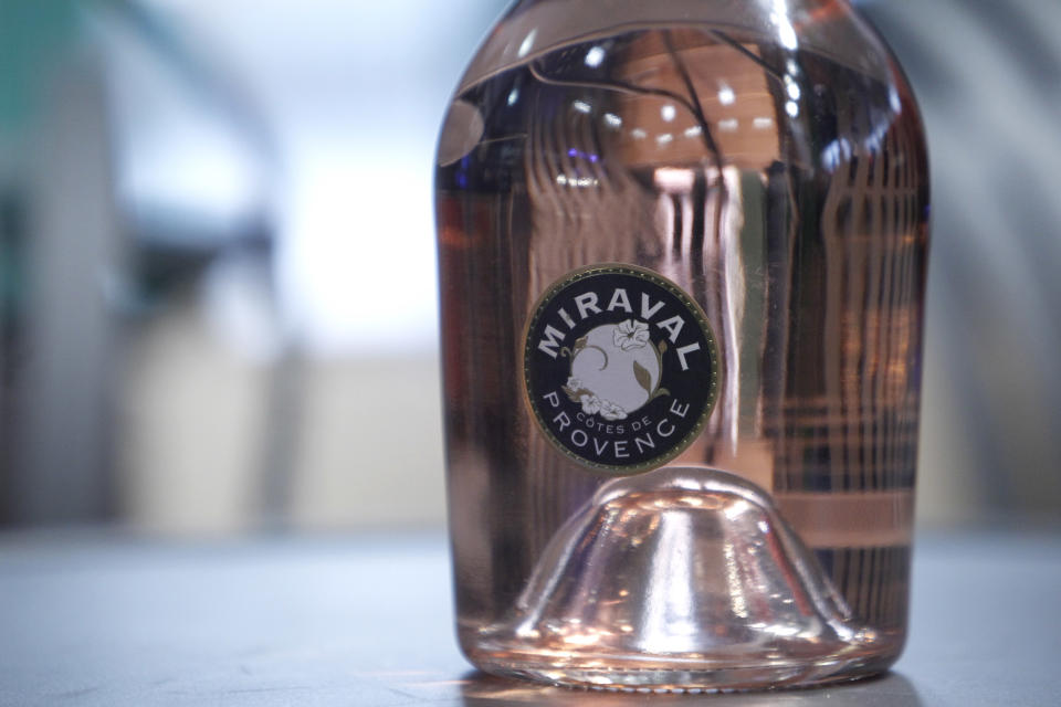 CAPTION CORRECTS NAME OF BOTTLE FROM MIRAMAR TO MIRAVAL A botlle of Miraval 2013 is pictured in Paris, Friday, Jan.31, 2014. The latest Brad Pitt-Angelina Jolie sequel is being described as powerful and elegant with a “mouthwatering finish.” These raves don’t appear in Hollywood bible Variety _ they’re from Decanter magazine’s review of the celebrity couple’s second vintage of rose wine produced at their Provencal estate Chateau Miraval. The 2013 Miraval goes on sale online Friday and will be in shops and restaurants around the world next month. (AP Photo/Thibault Camus)