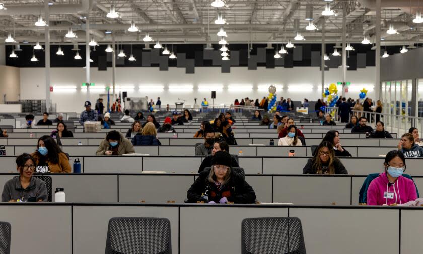 CITY OF INDUSTRY, CA - FEBRUARY 20: Workers at ballot extraction hall of new ballot processing center of Los Angeles County Registrar-Recorder/County Clerk at 13401 Crossroads Pkwy N in City of Industry, CA. (Irfan Khan / Los Angeles Times)