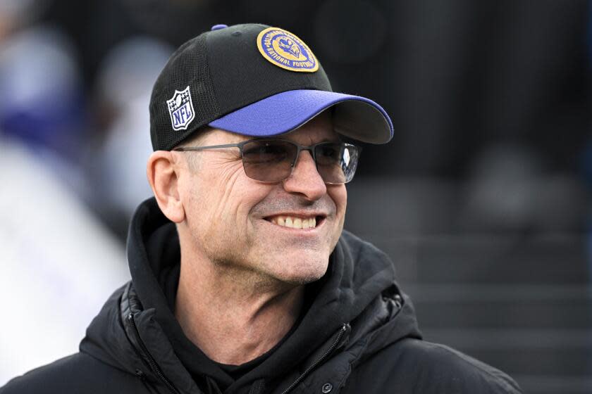 Jim Harbaugh looks on before his brother John's AFC playoff game as coach of the Ravens.