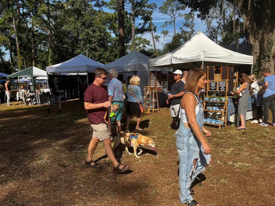 People and their pets peruse the artist tents at last year's Gordonston Art Fair.