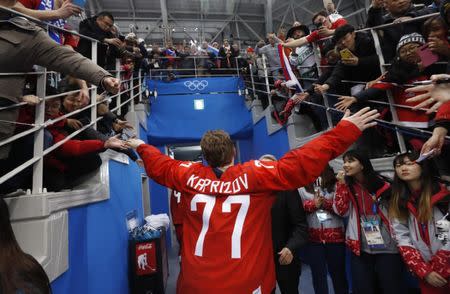Ice Hockey - Pyeongchang 2018 Winter Olympics - Men's Final Match - Russia - Germany - Gangneung Hockey Centre, Gangneung, South Korea - February 25, 2018 - Olympic Athlete from Russia Kirill Kaprizov reacts with supporters after Russia won. REUTERS/Kim Kyung-Hoon