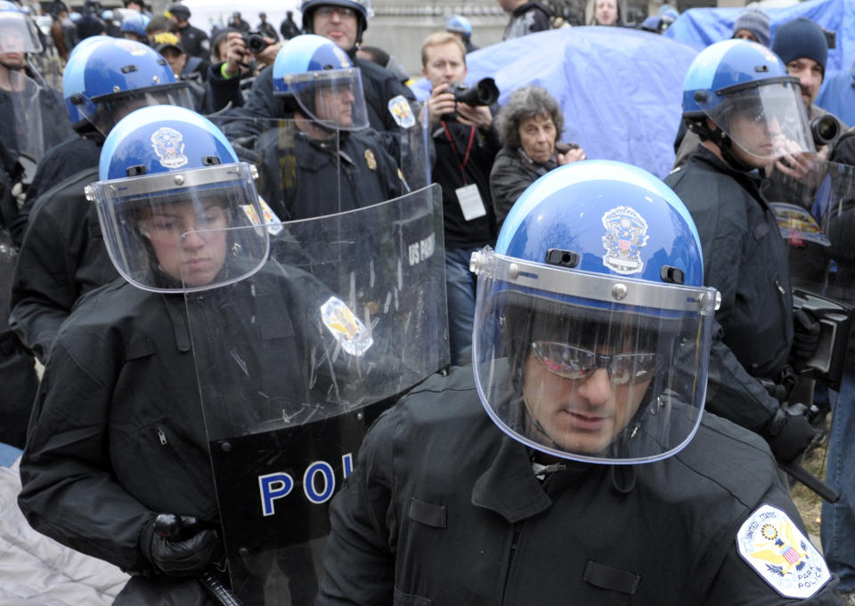 FILE - In this Feb. 4, 2012 file photo, U.S. Park Police are seen working in riot gear in Washington. Government and police officials in the nation’s capital say they are confident the city can manage to host this weekend’s planned white nationalist rally without violence. A small rally will take place Sunday in front of the White House and the participants may be dwarfed by larger counter-protests with police keeping the two sides apart. (AP Photo/Cliff Owen)