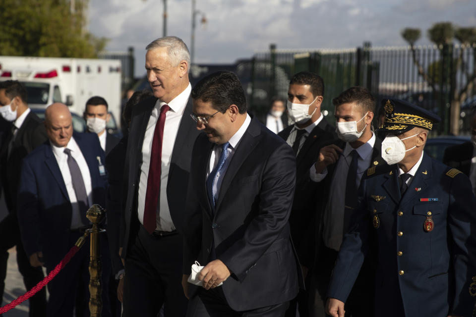 Israeli Defence Minister Benny Gantz is welcomed by Morocco's Foreign Minister Nasser Bourita, in Rabat, Morocco, Wednesday, Nov. 24, 2021. Israel and Morocco signed a landmark agreement Wednesday that lays the foundation for security cooperation, intelligence sharing, and future arms sales. (AP Photo/Mosa'ab Elshamy)