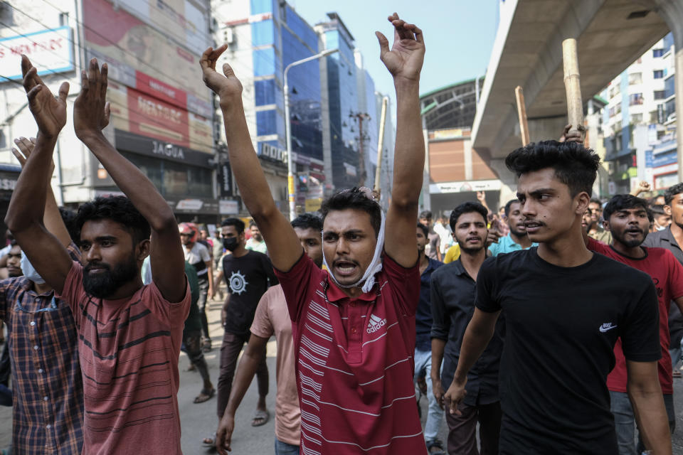 Bangladeshi garment workers shout slogans during a protest demanding an increase in their wages at Mirpur in Dhaka, Bangladesh, Tuesday, Oct.31, 2023. (AP Photo/Mahmud Hossain Opu)