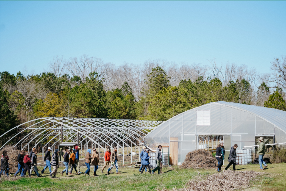 Farmers and participants at the 2023 Georgia Organics Conference & Expo tour Rag &Frass Farm in Jeffersonville, GA.