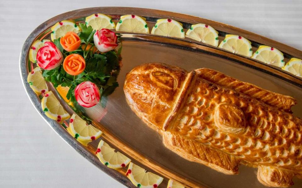 Sea bass in a puff pastry shell, one of the signature dishes at Paul Bocuse, the chef’s namesake Lyon restaurant.