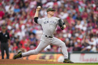 New York Yankees starting pitcher Clarke Schmidt throws to a Cincinnati Reds batter during the second inning of a baseball game in Cincinnati, Friday, May 19, 2023. (AP Photo/Jeff Dean)