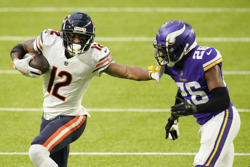 Chicago Bears wide receiver Allen Robinson II (12) runs from Minnesota Vikings cornerback Chris Jones (26) after catching a pass during the second half of an NFL football game, Sunday, Dec. 20, 2020, in Minneapolis. (AP Photo/Jim Mone)