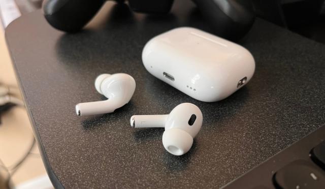 The new AirPods Pro shown here alongside their updated charging case.