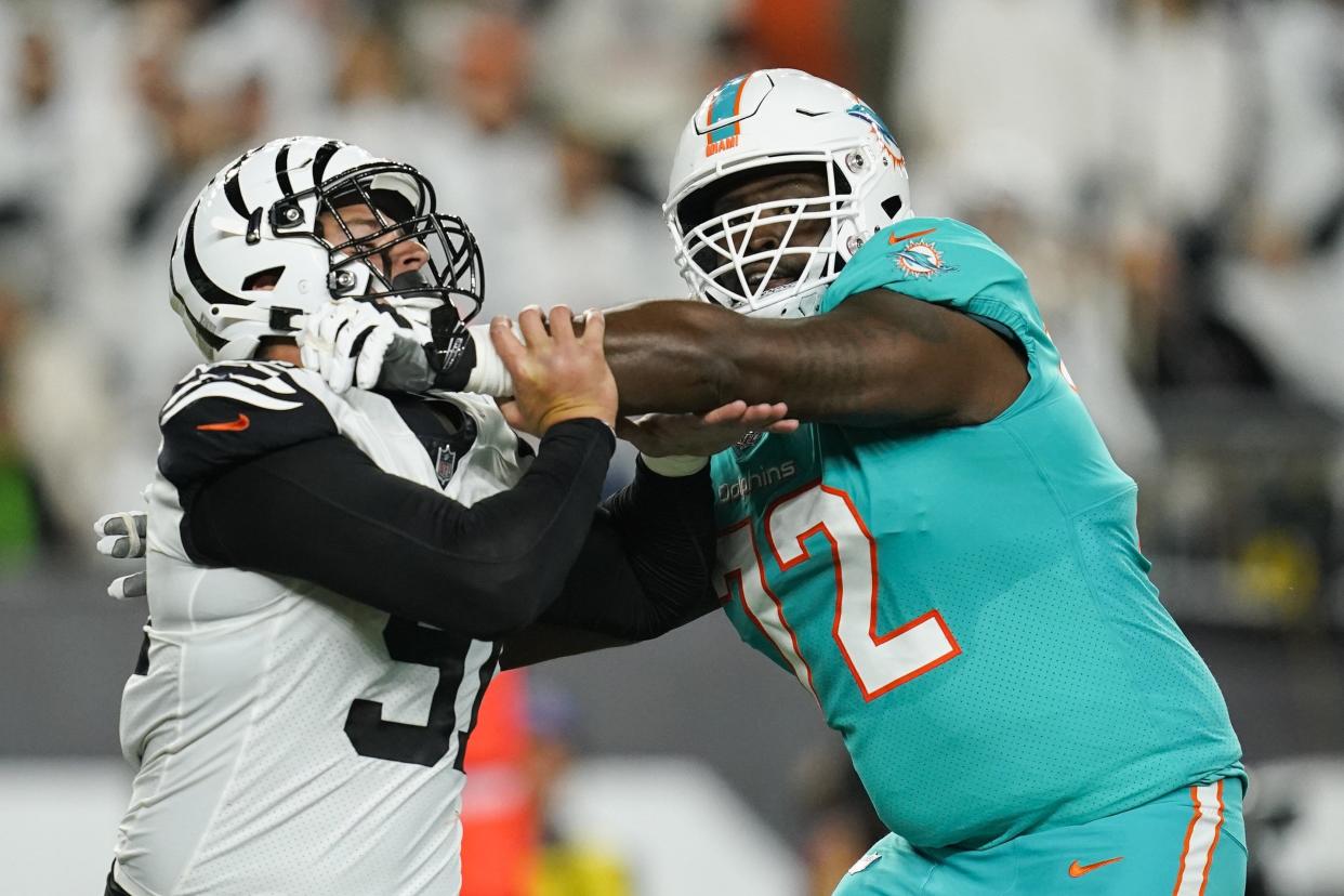 Miami Dolphins offensive tackle Terron Armstead (72) blocks Cincinnati Bengals defensive end Trey Hendrickson (91) during the second half of a NFL game between the Cincinnati Bengals and the Miami Dolphins on Thursday, Sept. 29, 2022 in Cincinnati. (AP Photo/Joshua A. Bickel)