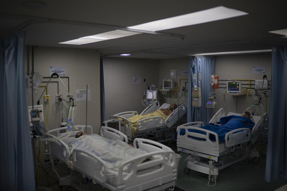 COVID-19 patients rest in the ICU of the Sao Jose municipal hospital, in Duque de Caxias, Brazil, Wednesday, March 24, 2021. (AP Photo/Felipe Dana)