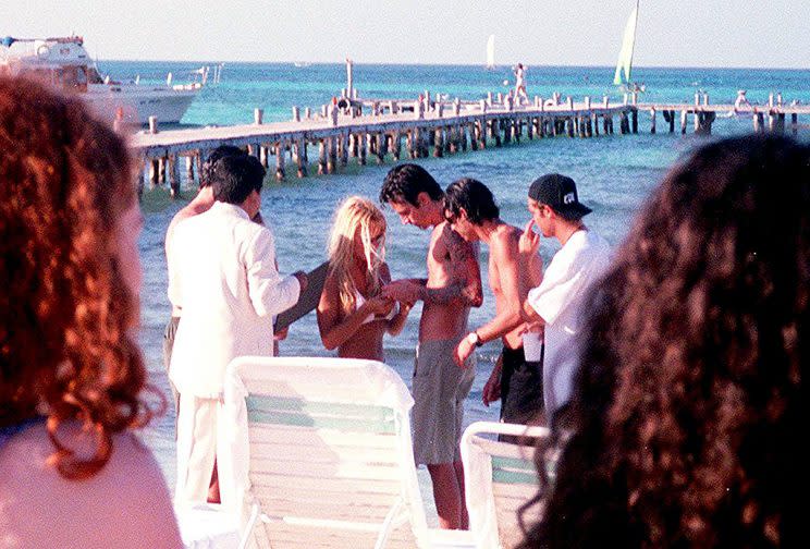 Pamela Anderson and Tommy Lee get married February 19, 1995 on the beach in Cancun, Mexico.