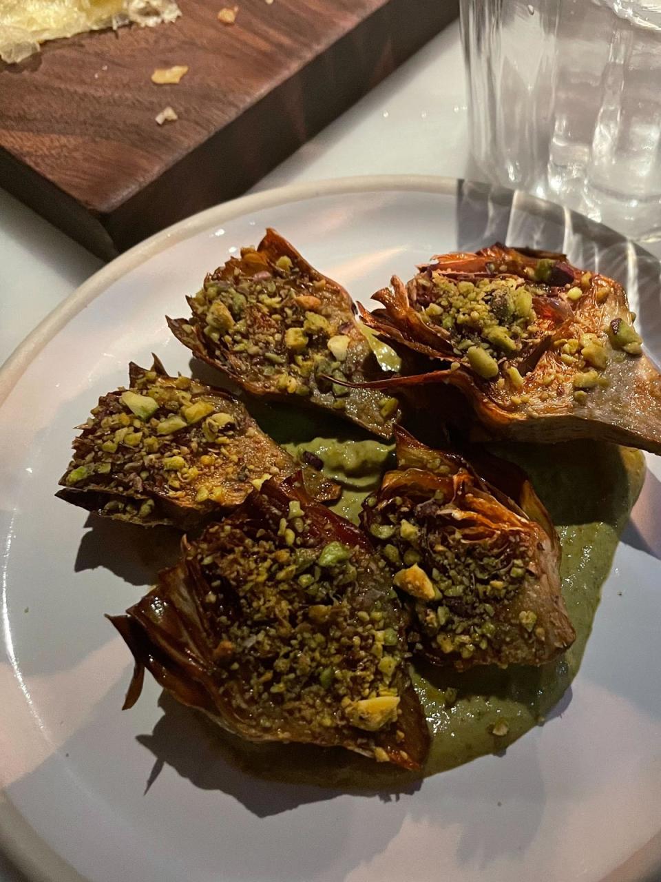 Baby artichokes fried with mint and pistachio to start (Kate Ng)