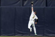 San Diego Padres center fielder Jackson Merrill makes a catch at the wall for the out on Colorado Rockies' Brenton Doyle during the fourth inning of a baseball game, Monday, May 13, 2024, in San Diego. (AP Photo/Gregory Bull)