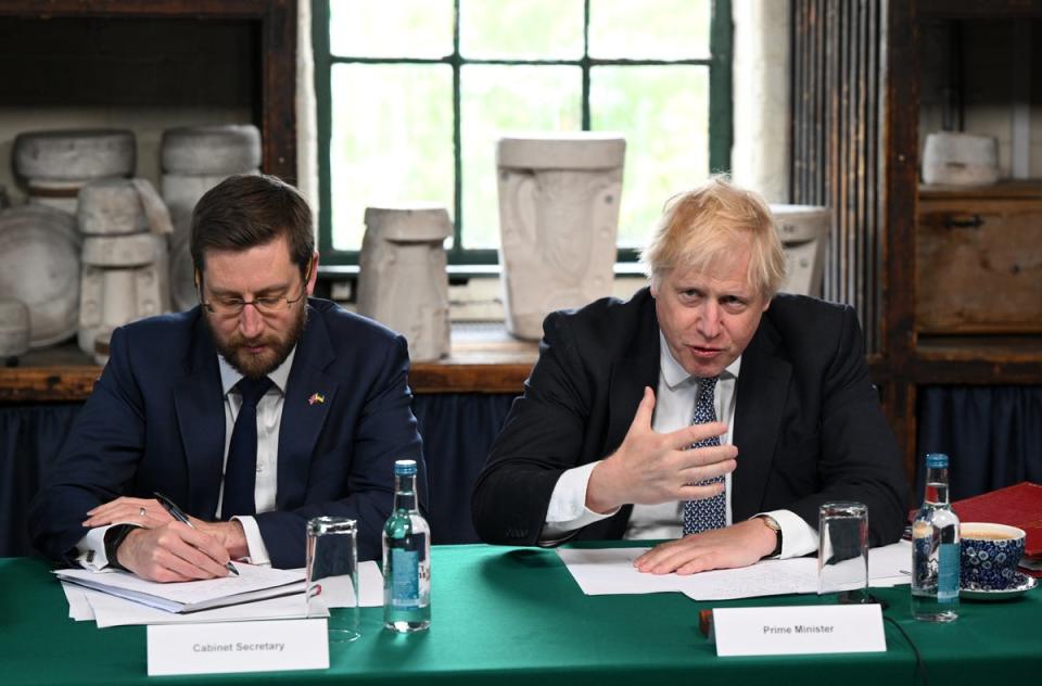 Cabinet secretary Simon Case and Boris Johnson (PA)