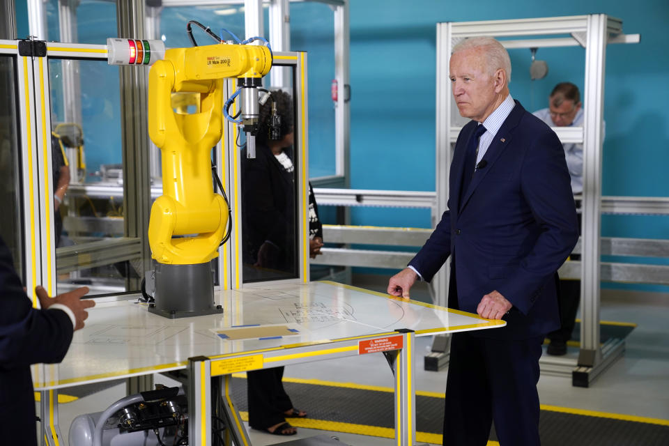 President Joe Biden listens during a tour of the Cuyahoga Community College Manufacturing Technology Center, Thursday, May 27, 2021, in Cleveland. (AP Photo/Evan Vucci)