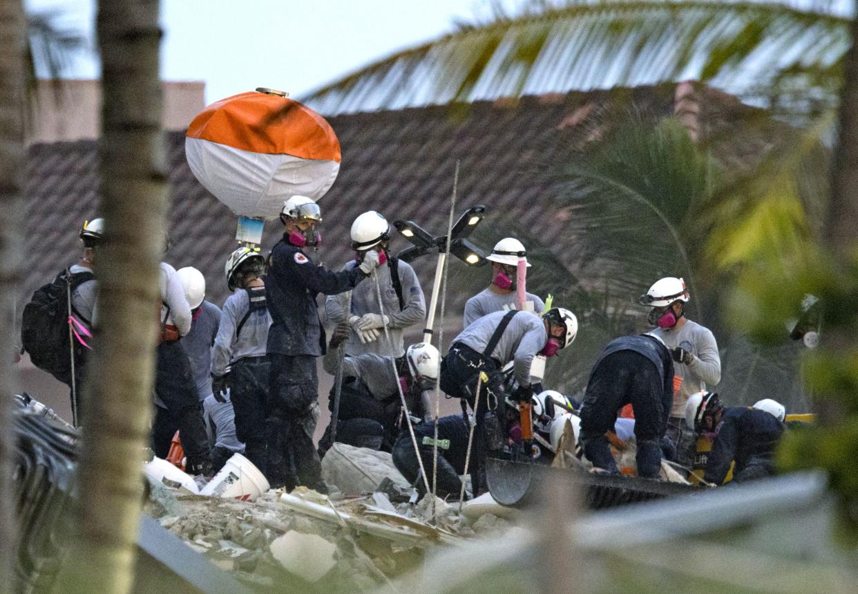 Search and rescue personnel search for survivors through the rubble at the Champlain Towers South Condo in Surfside, Fla. on Wednesday, June 30, 2021. The apartment building partially collapsed on Thursday, June 24.