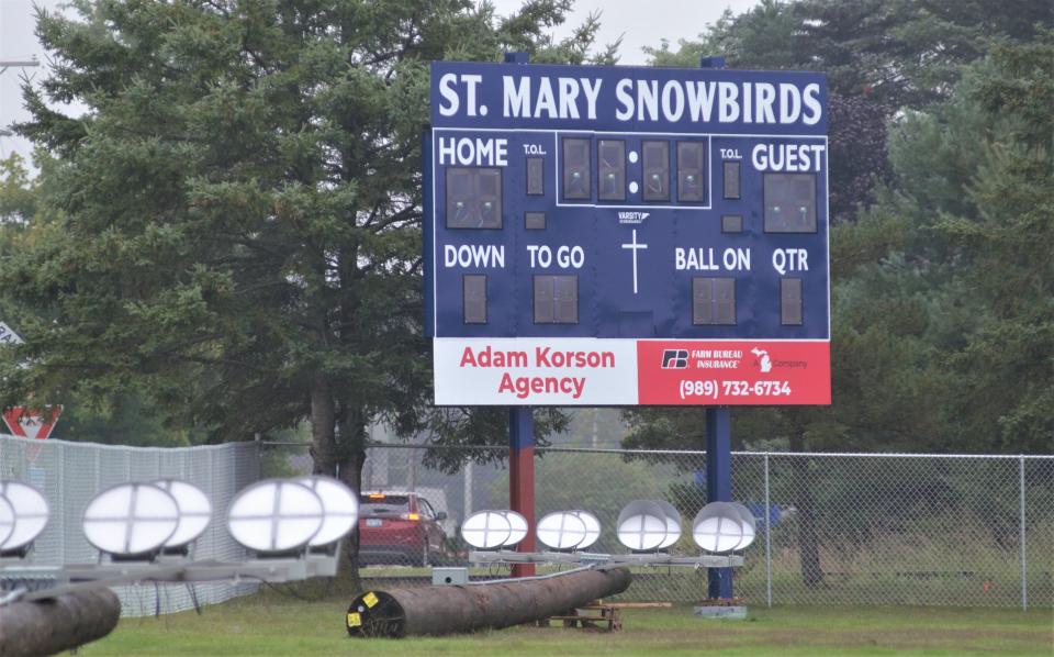 Stadium lights ready to be installed sit in fron tof the new scorebaord at Gaylord St. Mary's new football stadium, set to debut sometime in 2023.