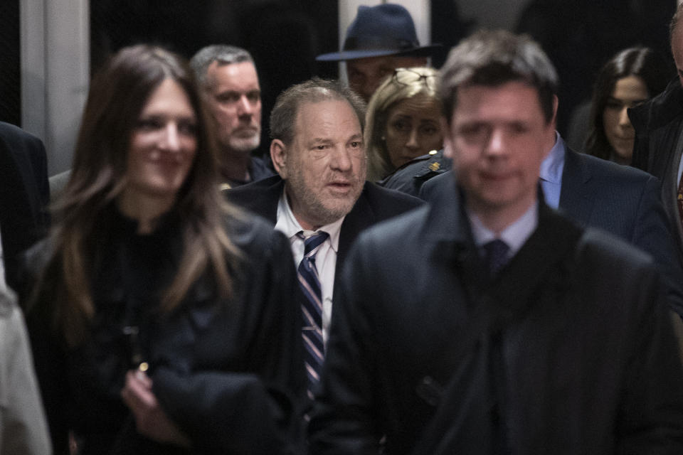 Harvey Weinstein, center, is surrounded by his attorneys Donna Rotunno, left, and Damon Cheronis, as he leaves court for the day in his rape trial, Thursday, Feb. 13, 2020, in New York. (AP Photo/Mary Altaffer)