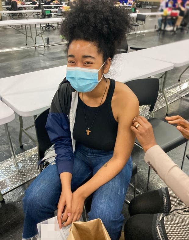 On Saturday, the province neared the 75 per cent vaccination mark. 'Because I want to get out of this pandemic faster, be able to go outside,' said Alberta resident Hannah McHugh, 19, about why she got her COVID-19 vaccination.  (Alberta Health Services - image credit)