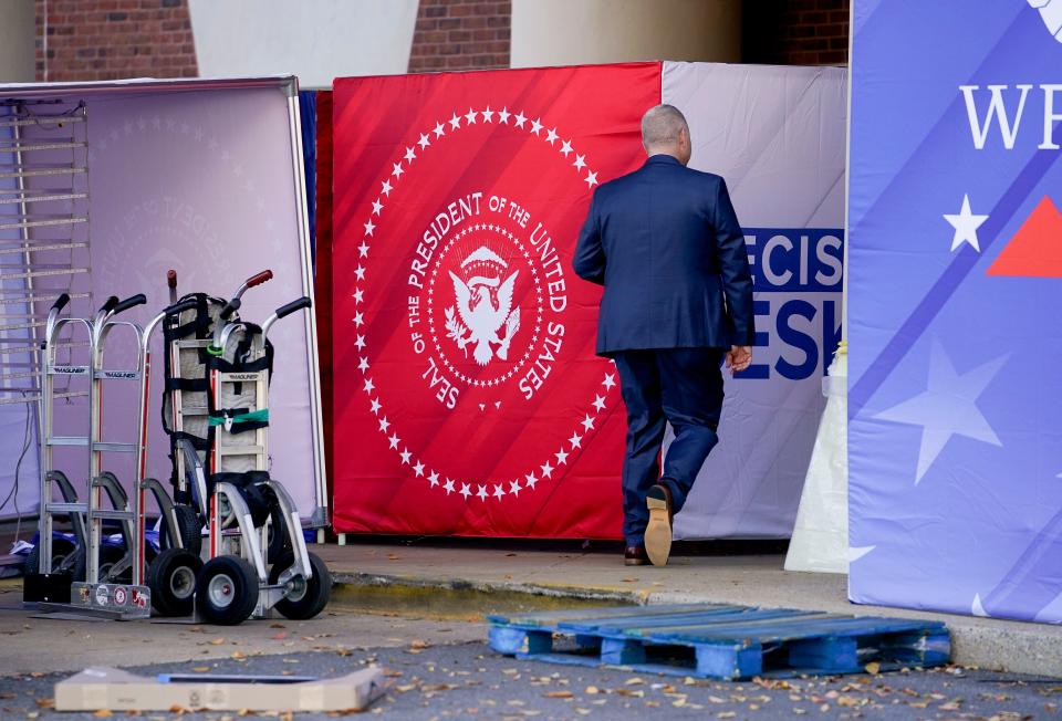 Sign riggers work on the signage for the Republican Primary Debate outside Moody Music Hall on the campus of the University of Alabama in Tuscaloosa Tuesday, Dec. 5, 2023. The debate takes places on Dec. 6.